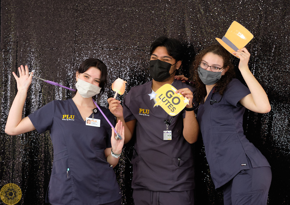 Three nursing students poising with Bjug Day photo props