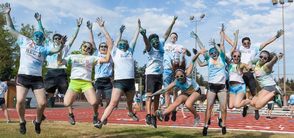 Students jumping for joy during the annual LuteFit Color Run