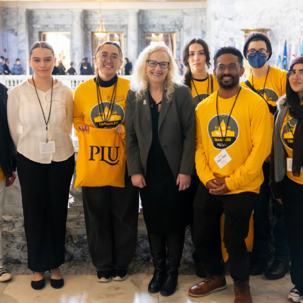 Students take a group photo a lobby day
