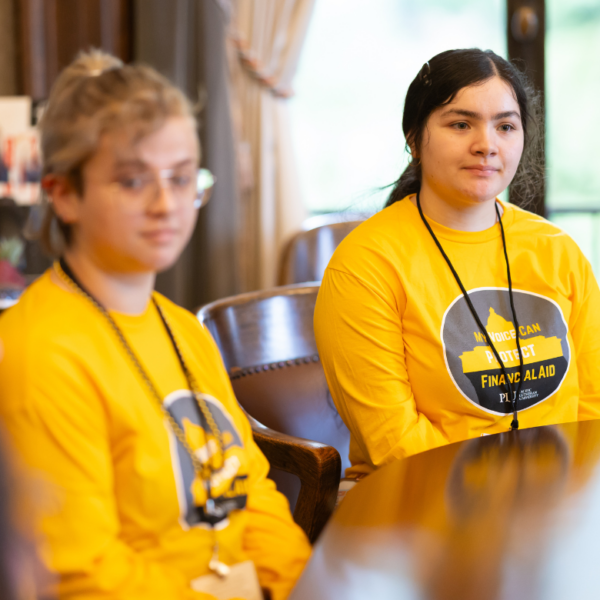Two students sit at a desk