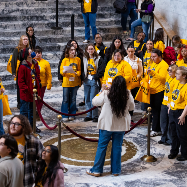 students stand in the Capital Building
