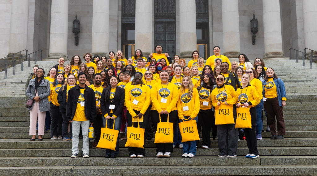 PLU students tand on the steps for lobby day.