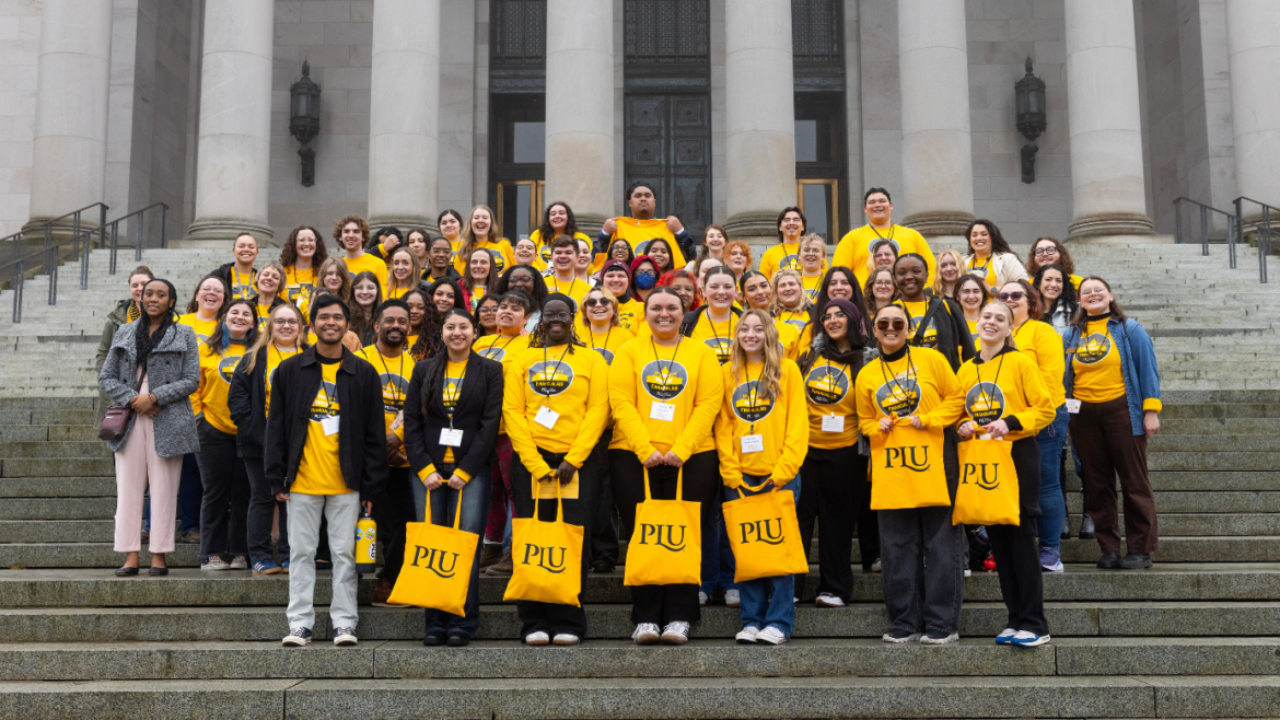 PLU students tand on the steps for lobby day.