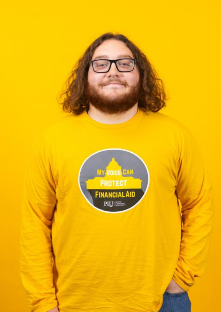Man wearing yellow Financial Aid shirt against yellow background