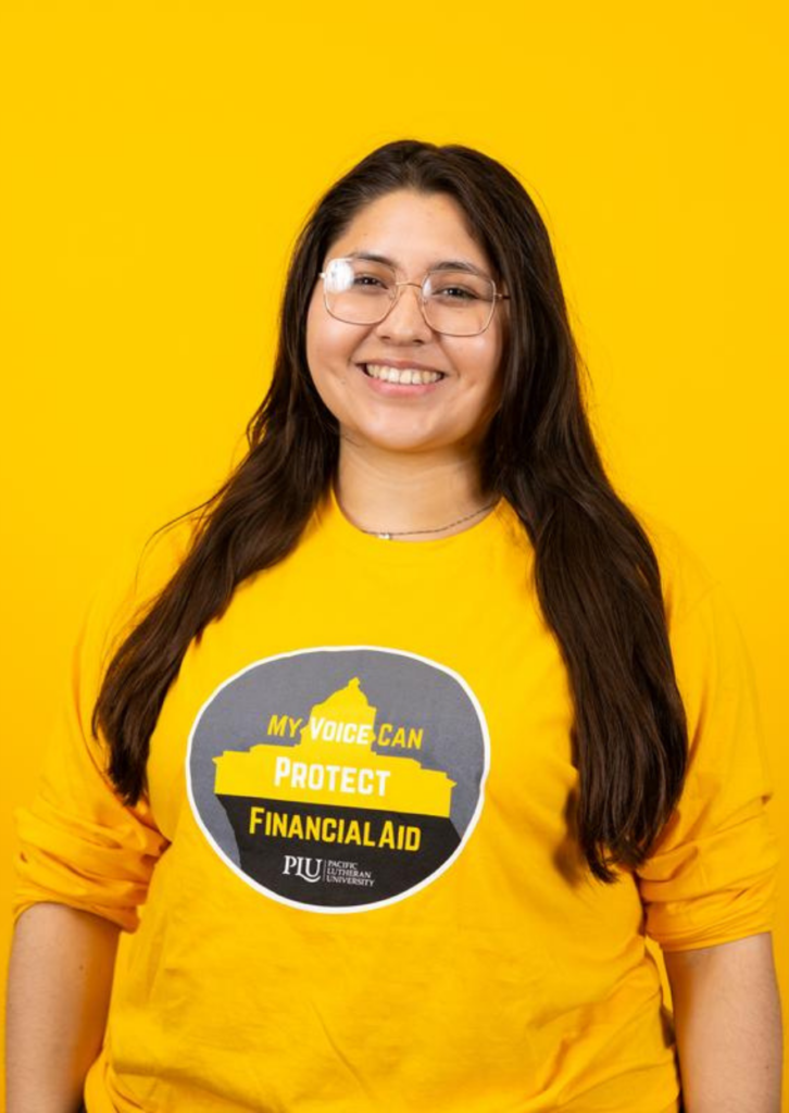 Young woman smiling in yellow financial aid awareness shirt