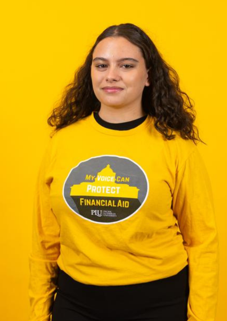 Woman wearing yellow sweatshirt with financial aid graphic on yellow background