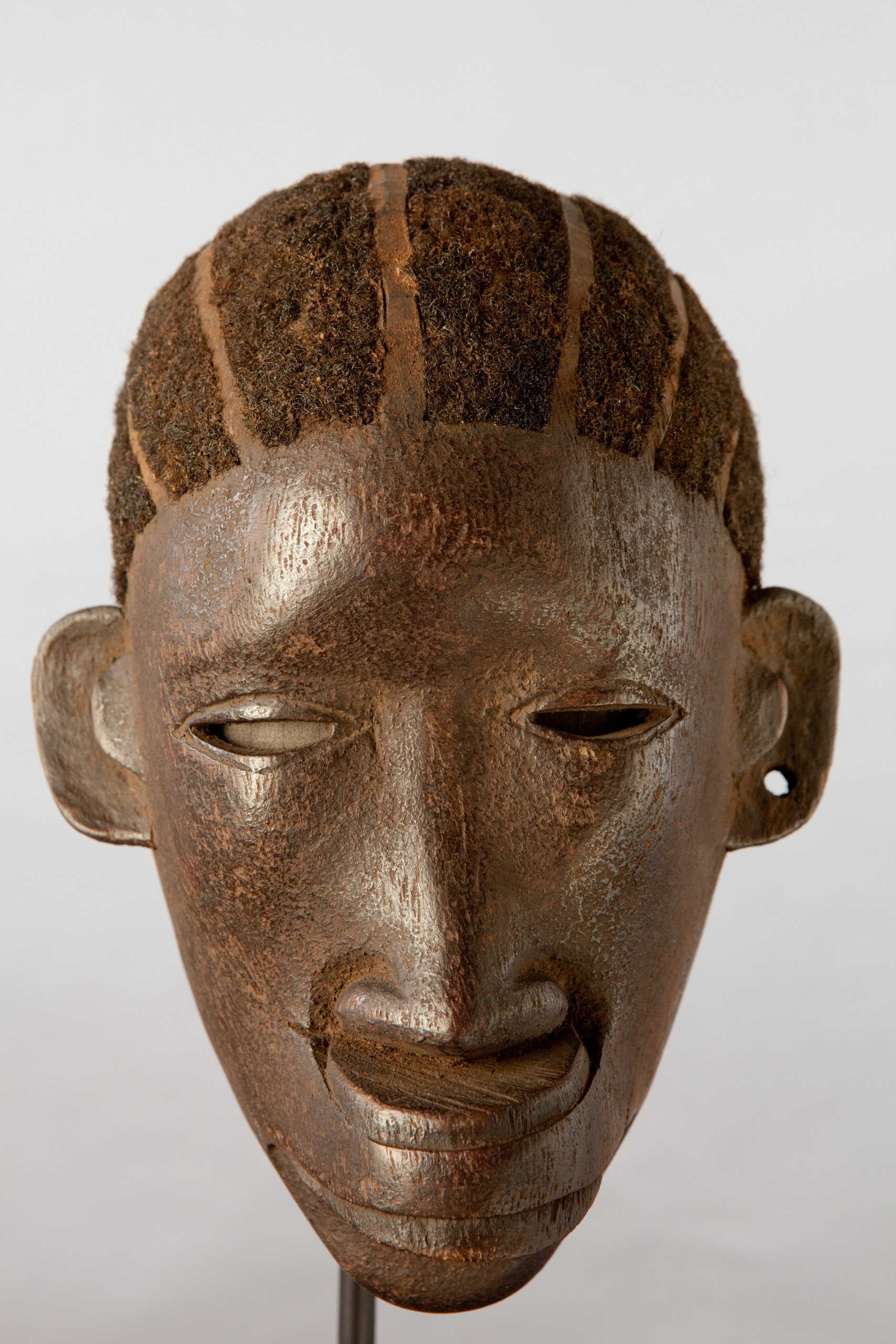 African artifacts part of the collection on display at the Mortvedt Library likomba-mask