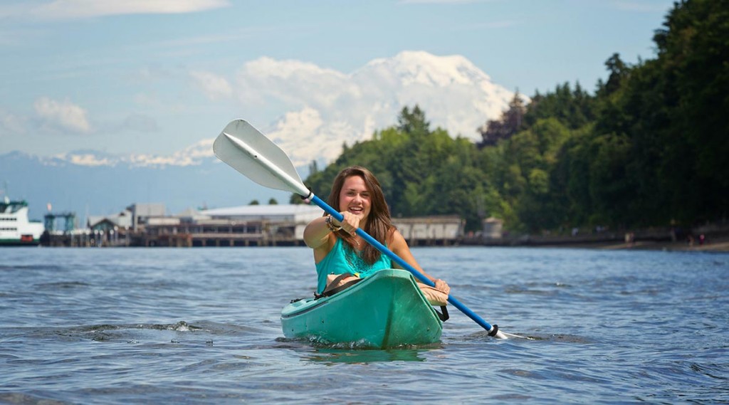 Erica Boyle '13, a Colorado native, paddles a kayak in Puget Sound at Owen Beach in Point Defiance Park in Tacoma. (Photo/John Froschauer)