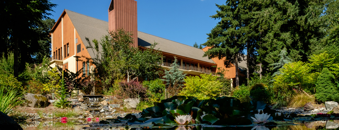 Summer pond In the summer on a sunny day a view of the Anderson University Center from the pond on lower campus.