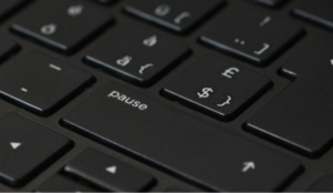 Close-up of keyboard, narrowed in on the "pause" key