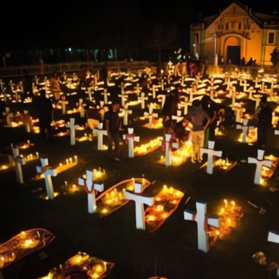 Image of a grave site with glowing candles