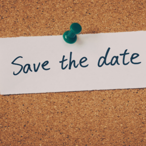 Image of a bulletin board with an attached paper by thumbtack that says "Save the date"