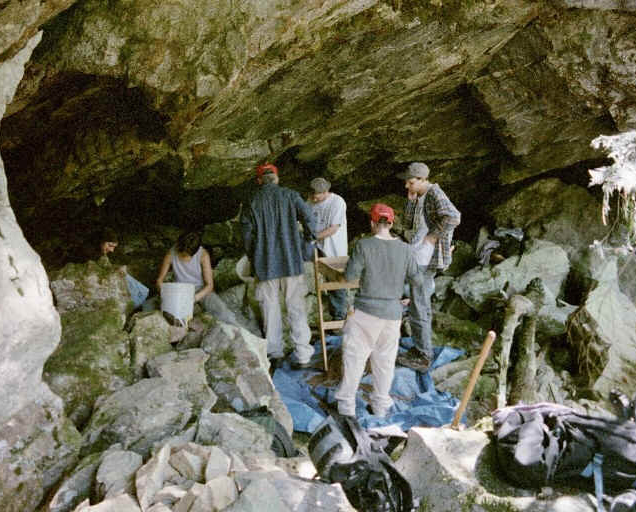 Students working in a cave