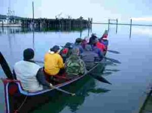 Students paddling canoe