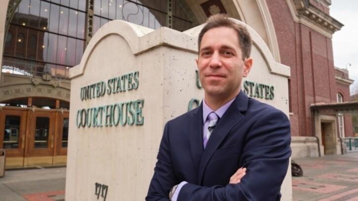 Image: Professor Jordan Levy in front of the Federal Courthouse in Downtown Tacoma. (Photo: John Froschauer/PLU)