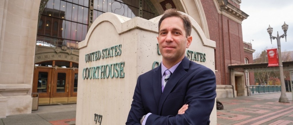 Image: Professor Jordan Levy in front of the Federal Courthouse in Downtown Tacoma. (Photo: John Froschauer/PLU)