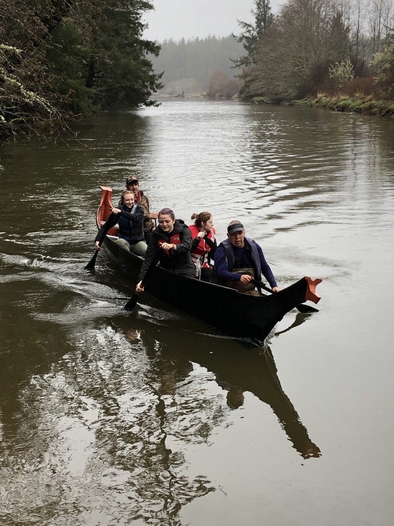 Students paddling in canoe