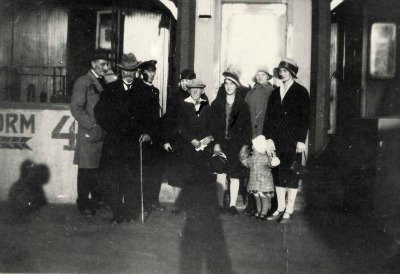 group photo of people standing in front of building