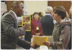 PLU student talking to a career fair recruiter