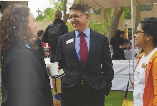 President Krise talking with two others