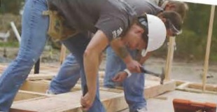 Students volunteering to build a home
