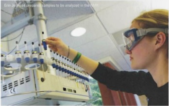Student working with the nuclear magnetic resonance spectrometer