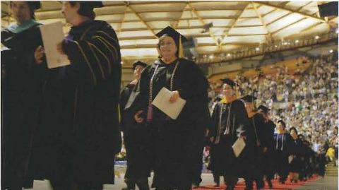 Students walking at commencement in the Tacoma Dome