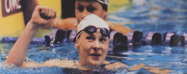 PLU student Megan Quann celebrates her first place finish in the 100 meter breaststroke at the US Open in Federal Way, WA. Quann previously won 2 gold medals at the 2000 Olympics in Sydney, Australia at the age of 17.