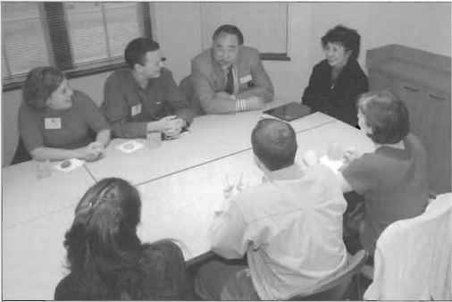 Peter and Grace Wang talking with others