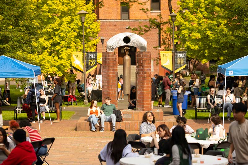 Students, Students, faculty, and staff gather on Red Square for the 4th Annual Studal Farmers Market, Tuesday, May 6, 2025, at PLU. (PLU Photo / Sy Bean), and staff gather on Red Square for the 4th Annual Studal Farmers Market, Tuesday, May 6, 2025, at PLU. (PLU Photo / Sy Bean)
