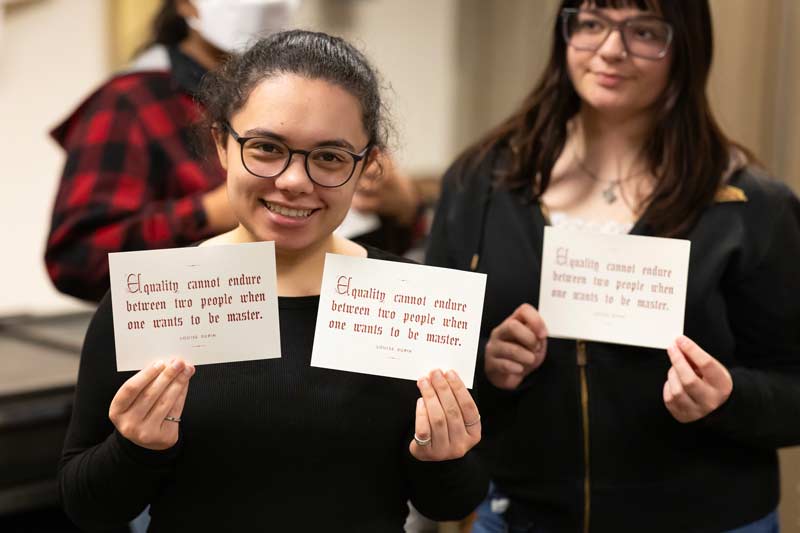 Rebecca Wilkin, Director of French and Francophone Studies, takes her FREN 206/406 “Francophone Feminisms” class to a printing press demonstration with Visiting Instructor of Art and Design Taylor Cox, Friday, Oct. 31, 2025, in Ingram Hall at PLU. (PLU Photo / Sy Bean)