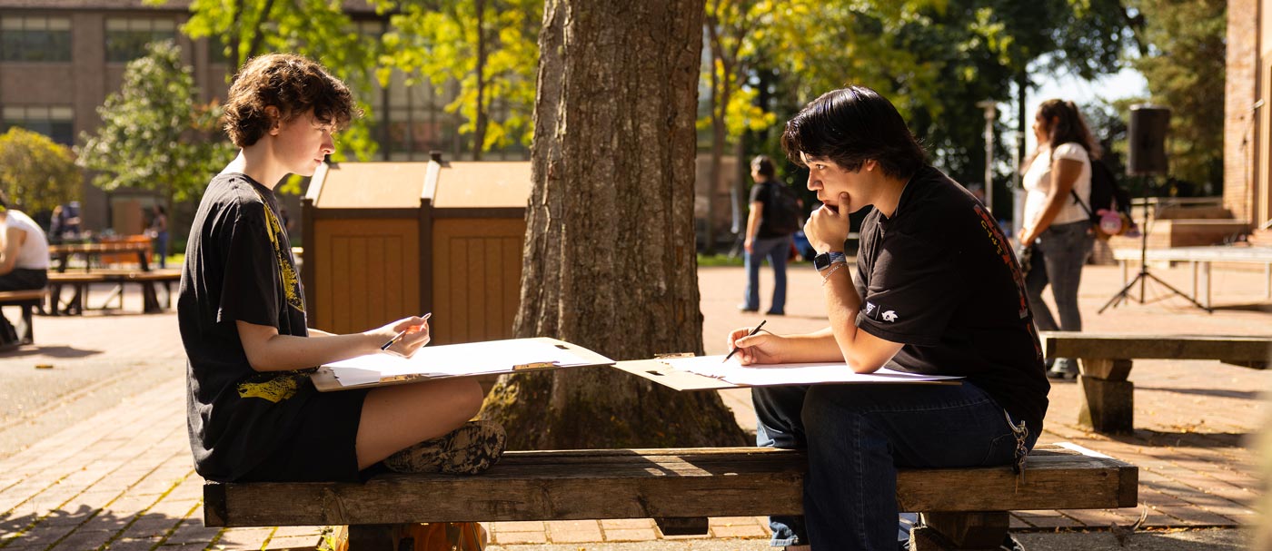 Students in the course ARTD 101 titled “Drawing 1 CX” draw portraits of fellow classmates outside on a sunny day, Wednesday, Sept. 9, 2026, on Red Square at PLU. The course explores basic techniques and media of drawing. (PLU Photo / Sy Bean) Students in the course ARTD 101 titled “Drawing 1 CX” draw portraits of fellow classmates outside on a sunny day, Wednesday, Sept. 9, 2026, on Red Square at PLU. The course explores basic techniques and media of drawing. (PLU Photo / Sy Bean)