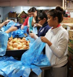students packaging onions