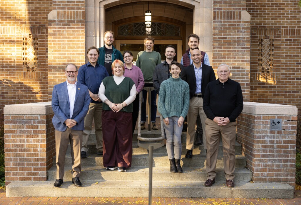 Benson Alumni Group Photo Oct 2025- resized Group of people standing on the steps of a building.