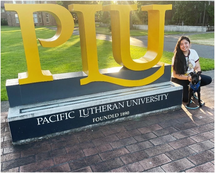 CD Dream Gonzales & her dog CD Dream Gonzales & her dog in front of PLU sign