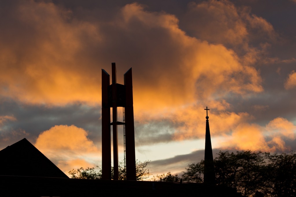 Clock tower and the steeple of the Karen Hille Phillips Performing Arts Center against a sunset at PLU on Wednesday, May 23, 2012(Photo/John Froschauer)