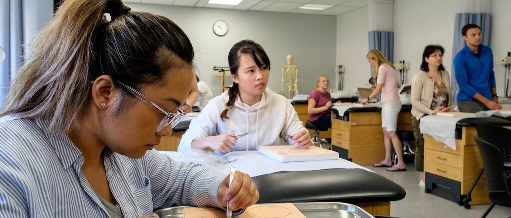 Students working on nursing procedures