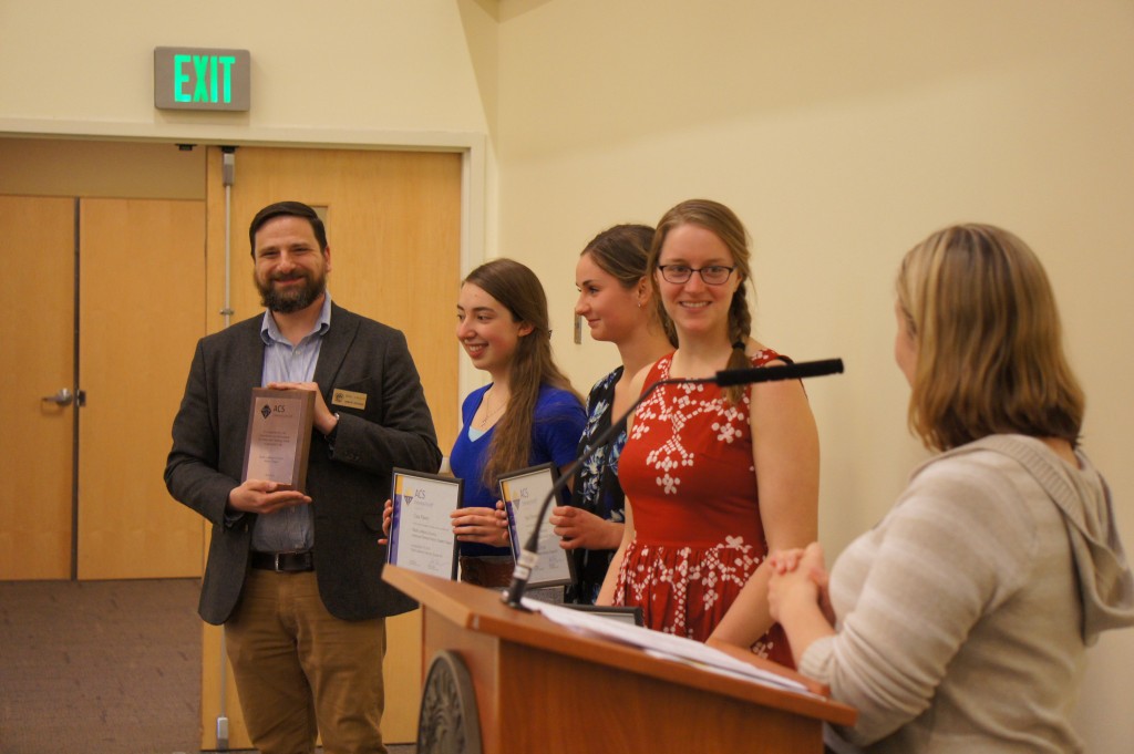 Neal Yakelis and Chemistry Club students with awards