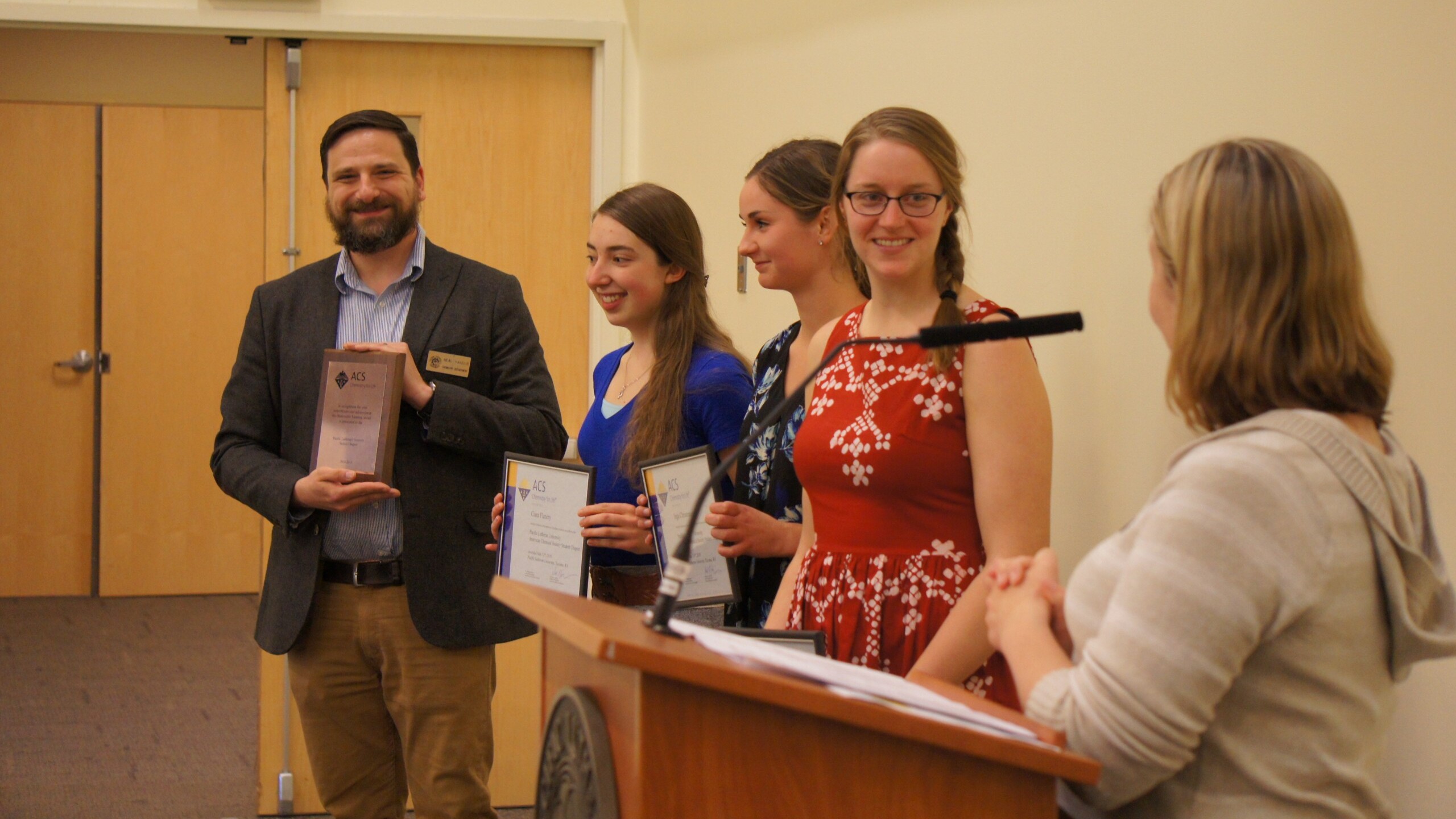 Neal Yakelis and Chemistry Club students with awards