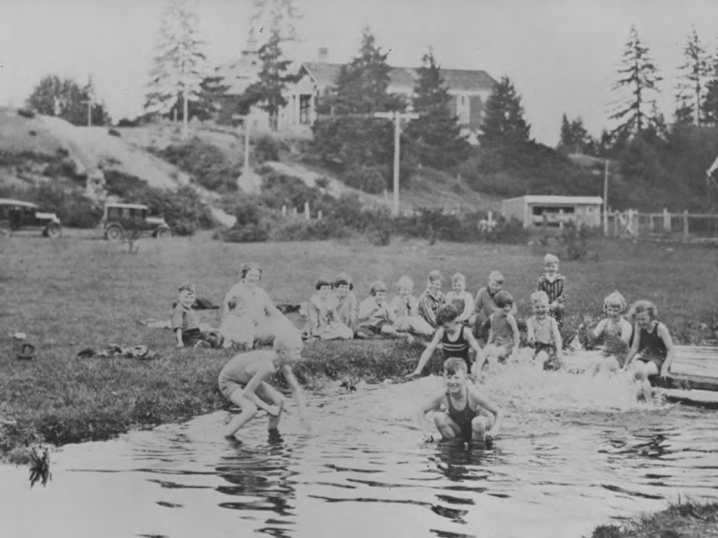 Young people playing in Clover Creek at PLU a long time ago