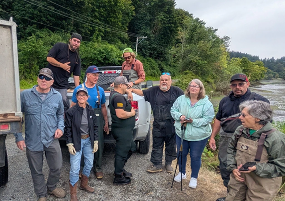 volunteers on the bank of a river