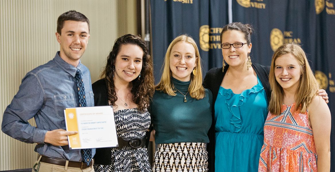 Club awards and recognitions - students posing with award