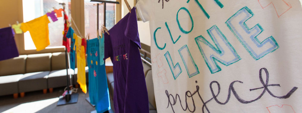 Clothesline Project at PLU on Monday, April 18, 2016. (Photo: John Froschauer/PLU) T-shirts hung up on a clothes line.