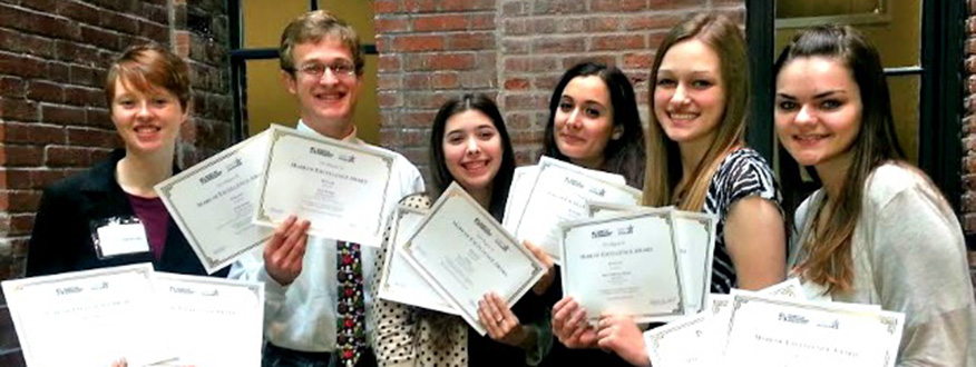 Photo from left to right: Mast Media staff members Alison Haywood '14, Sam Horn '15, Storm Gerlock '14, Ashley Gill '15, Leah Traxel '14, Jessica Trondsen '14