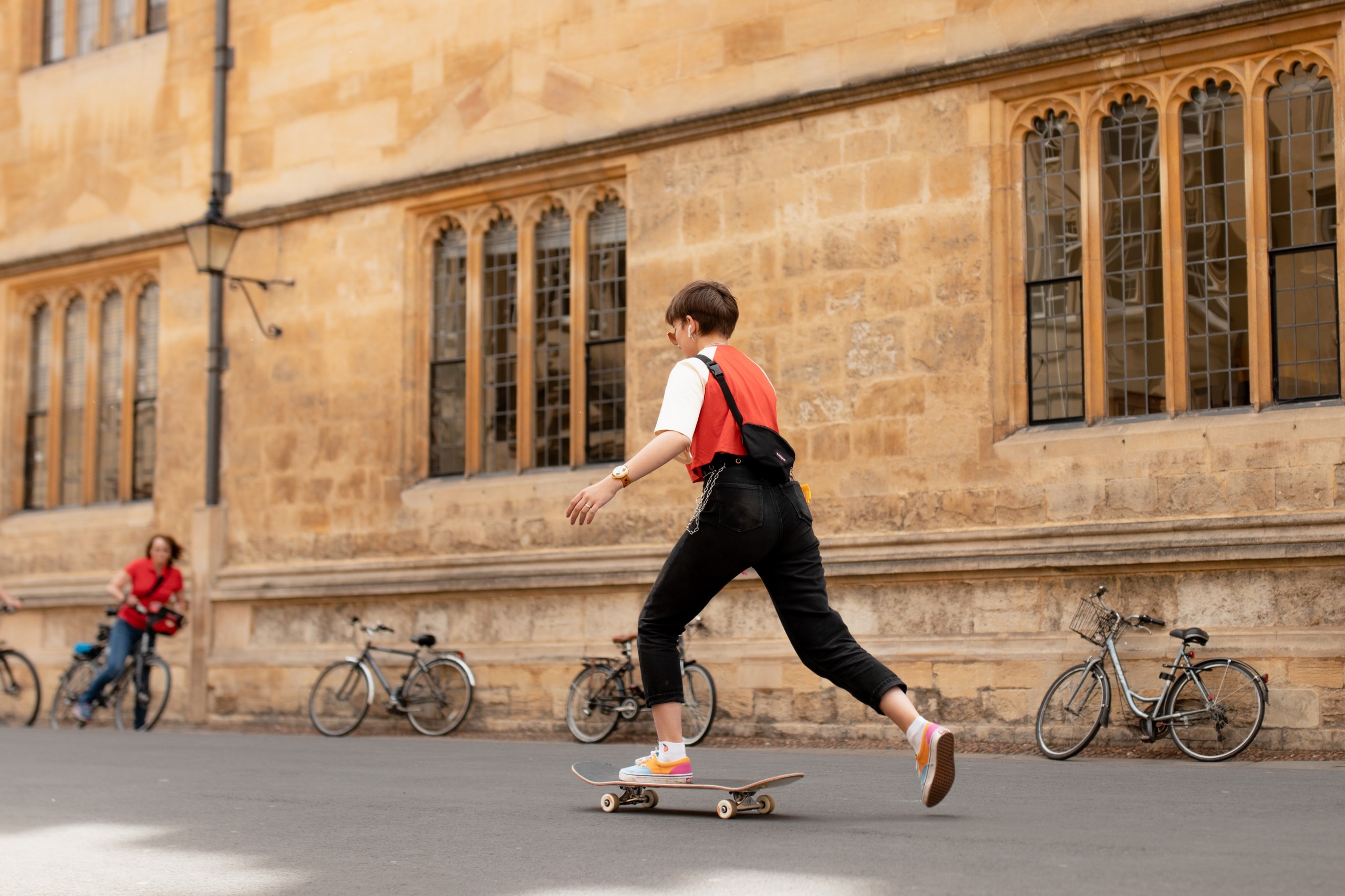 Student skateboarding in Oxford