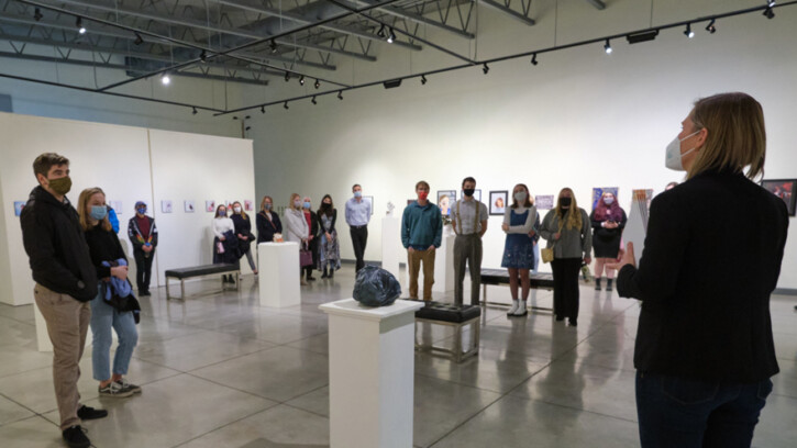 Students and guests assemble in the University Gallery for the opening of the 2021 Juried Student Art Exhibit