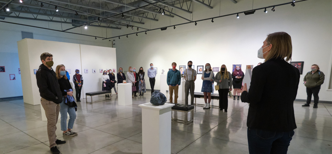 Students and guests assemble in the University Gallery for the opening of the 2021 Juried Student Art Exhibit