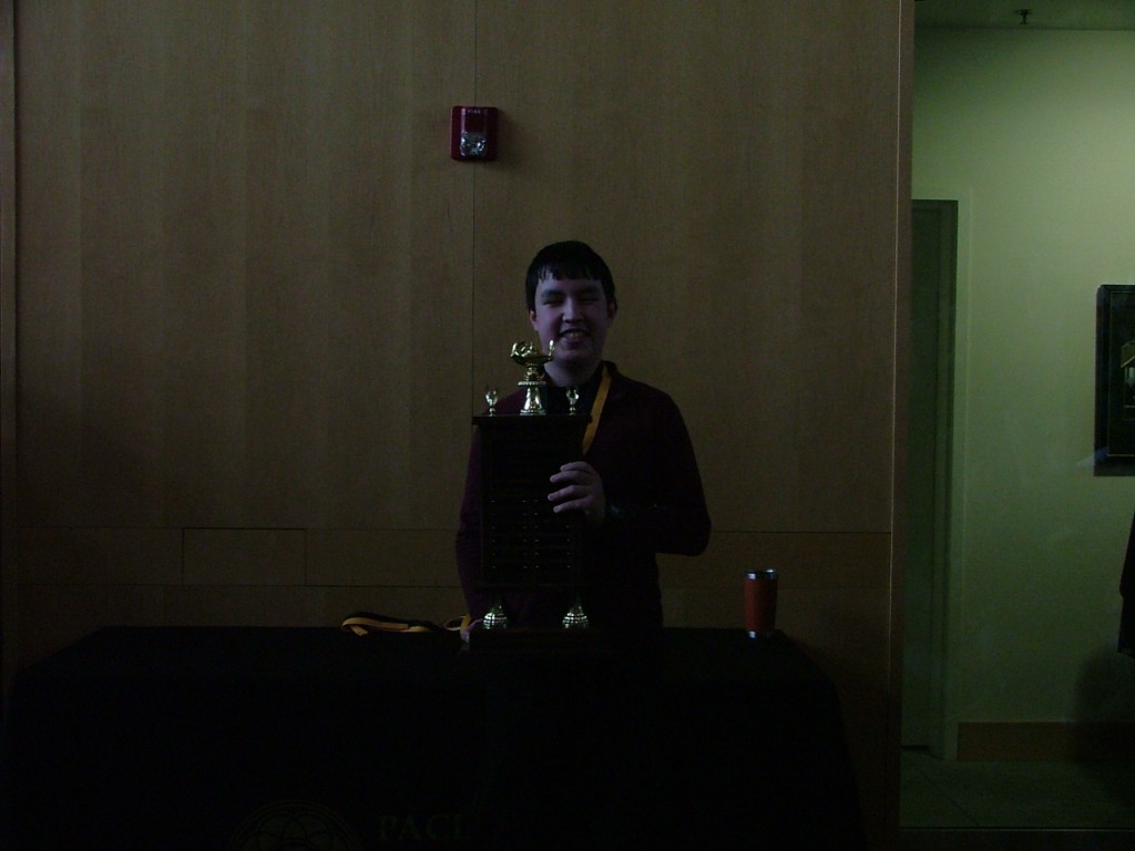 student holding trophy