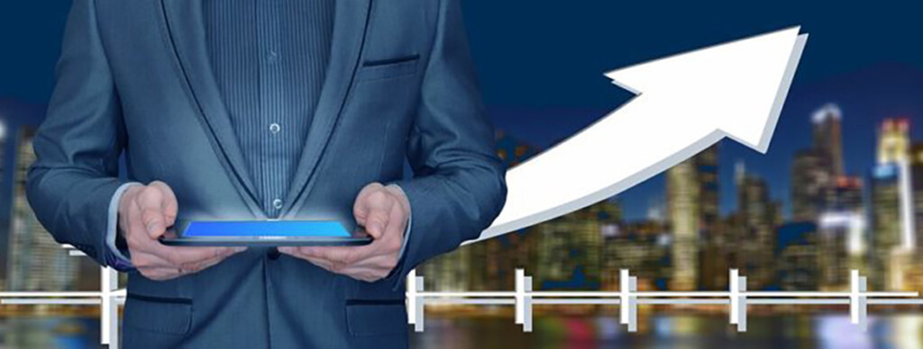 A person holding a tablet with an arrow pointing to the right.