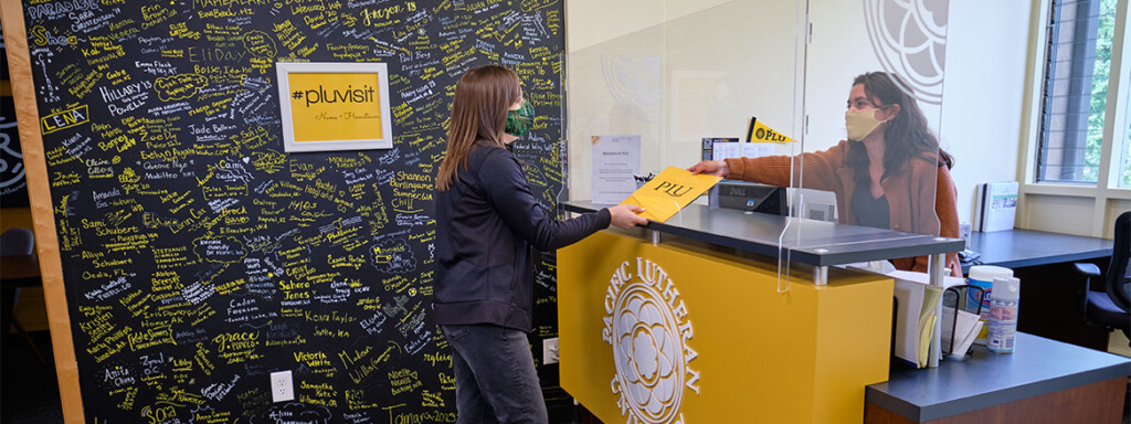 A prospective student stops by PLU's COVID-19 renovated Welcome Center